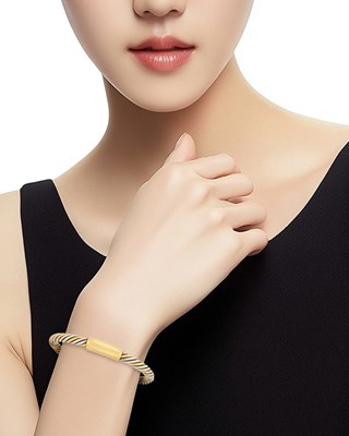 Lot 17 - Van Cleef & Arpels Two-Color Gold Bangle Bracelet