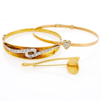 Lot 1025 - Tiffany & Co. Two-Color Gold and Diamond Heart Bangle, Angela Cummings Gold Gingko Leaf Brooch and Bangle Bracelet