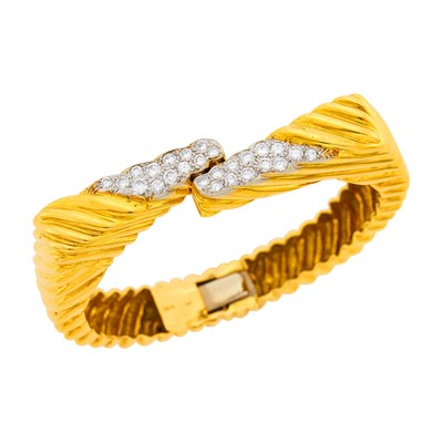 Lot 147 - Two-Color Gold and Diamond Bangle Bracelet