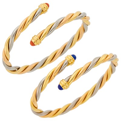 Lot 35 - Cartier Pair of Tricolor Gold, Lapis and Coral 'Trilogy' Bangle Bracelets, France