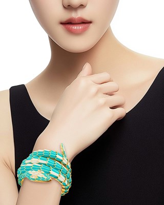 Lot 69 - Illario Gold, Turquoise and White Enamel and Diamond Serpent Bracelet