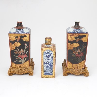 Lot 91 - Group of Three Japanese Gilt-Lacquer Mounted Blue and White Porcelain Jars