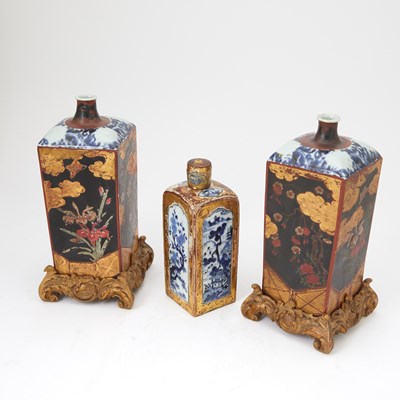 Lot 91 - Group of Three Japanese Gilt-Lacquer Mounted Blue and White Porcelain Jars