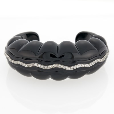 Lot 3134 - Carved Black Onyx, White Gold and Diamond Cuff Bangle