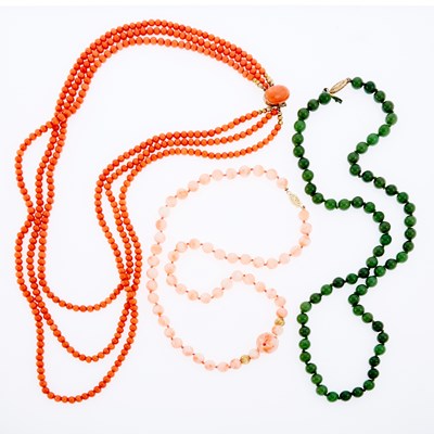 Lot 3321 - Three Coral, Angel Skin Coral and Nephrite Bead Necklaces with Gold Clasps