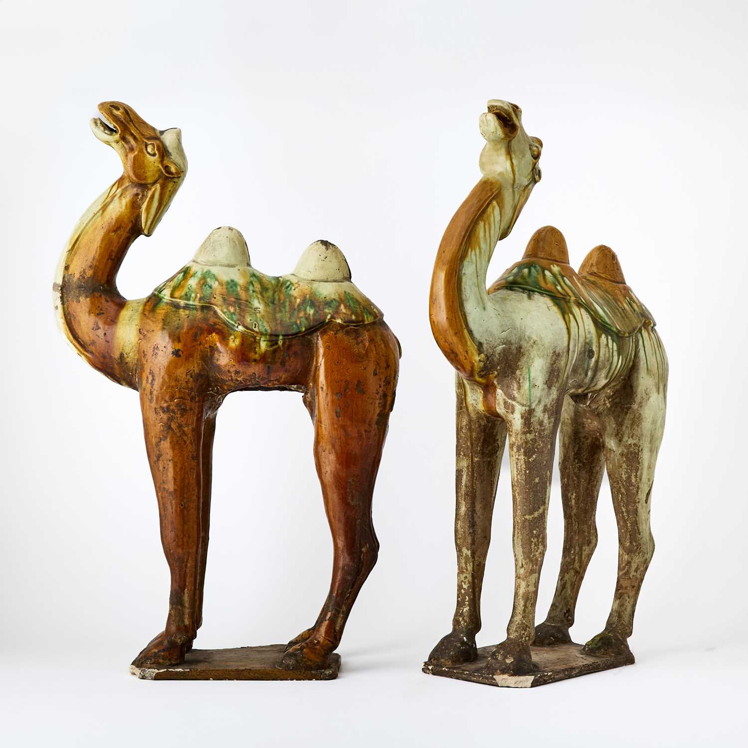 Lot 126 - Pair of Chinese Tang Style Sancai Glazed Pottery Figures of Bactrian Camels