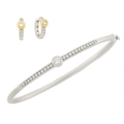 Lot 3120 - Two-Color Gold and Diamond Bangle Bracelet and Pair of Hoop Earrings