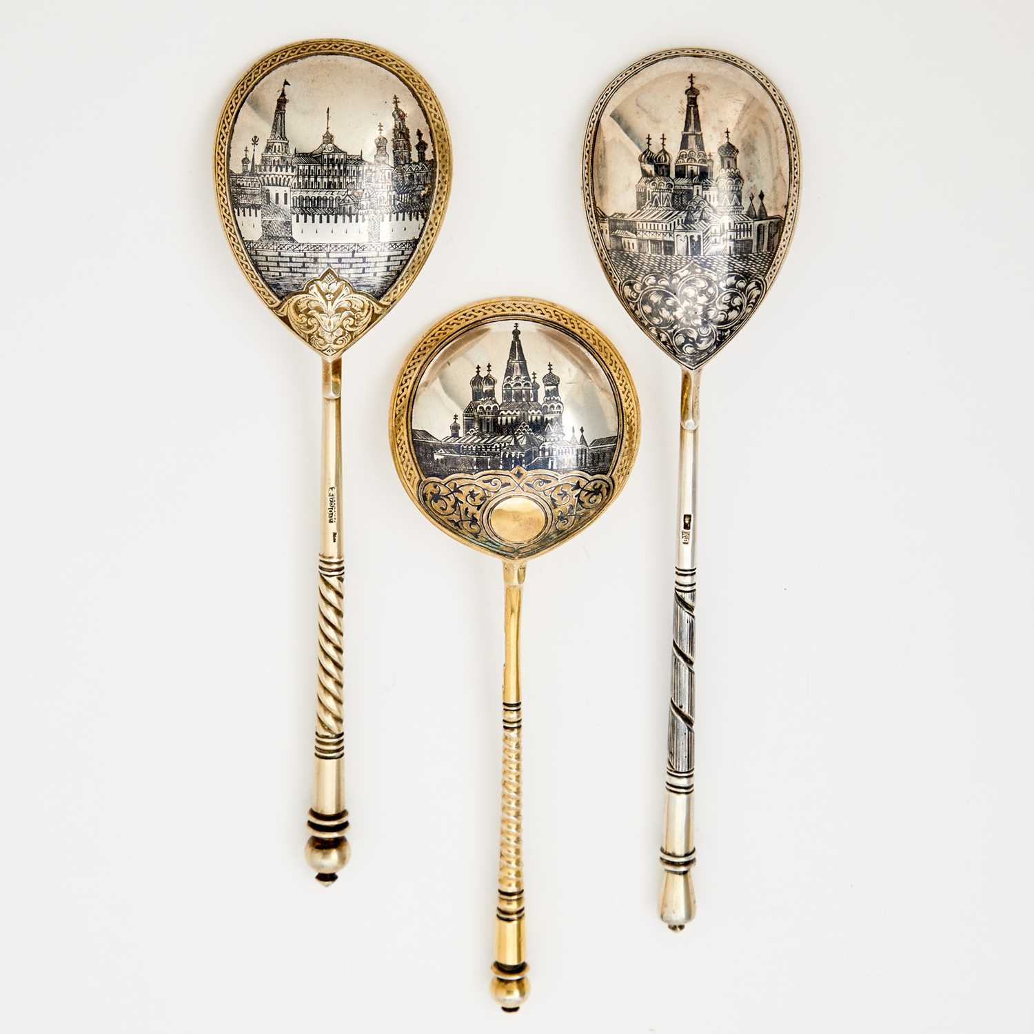 Lot 104 - Three Russian Silver-Gilt Niello Spoons