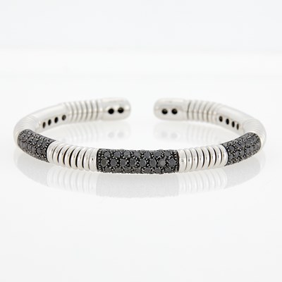 Lot 3137 - White Gold and Black Diamond Bangle Bracelet