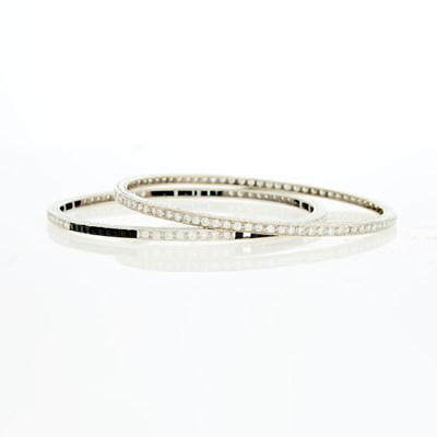 Lot 2112 - Pair of White Gold, Diamond and Black Onyx Bangle Bracelets
