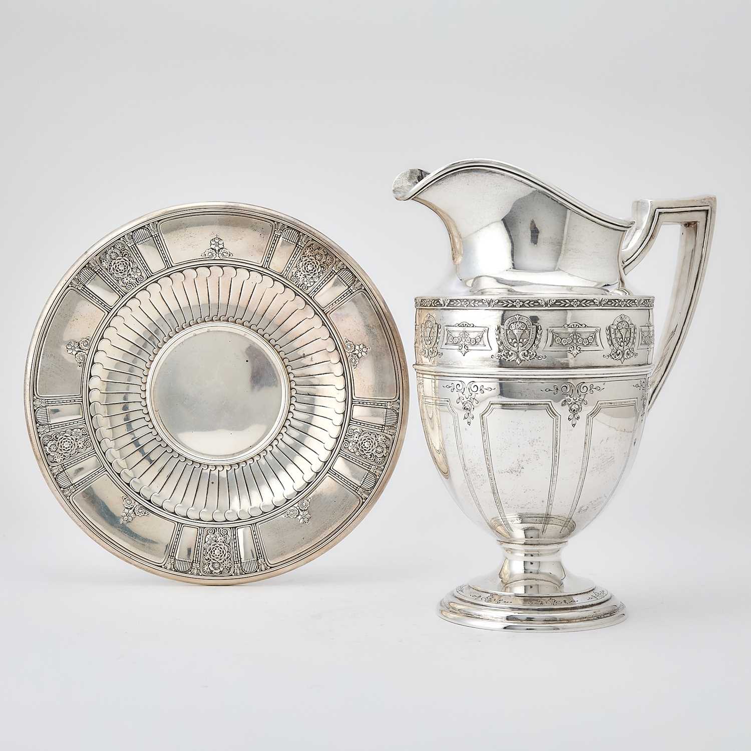Lot 181 - Graff, Washbourne & Dunn for Brand-Chatillon Sterling Silver Water Pitcher and Similar Footed Stand