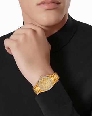 Lot 1063 - Rolex Gold and Diamond 'Day-Date' Wristwatch, Ref. 18036