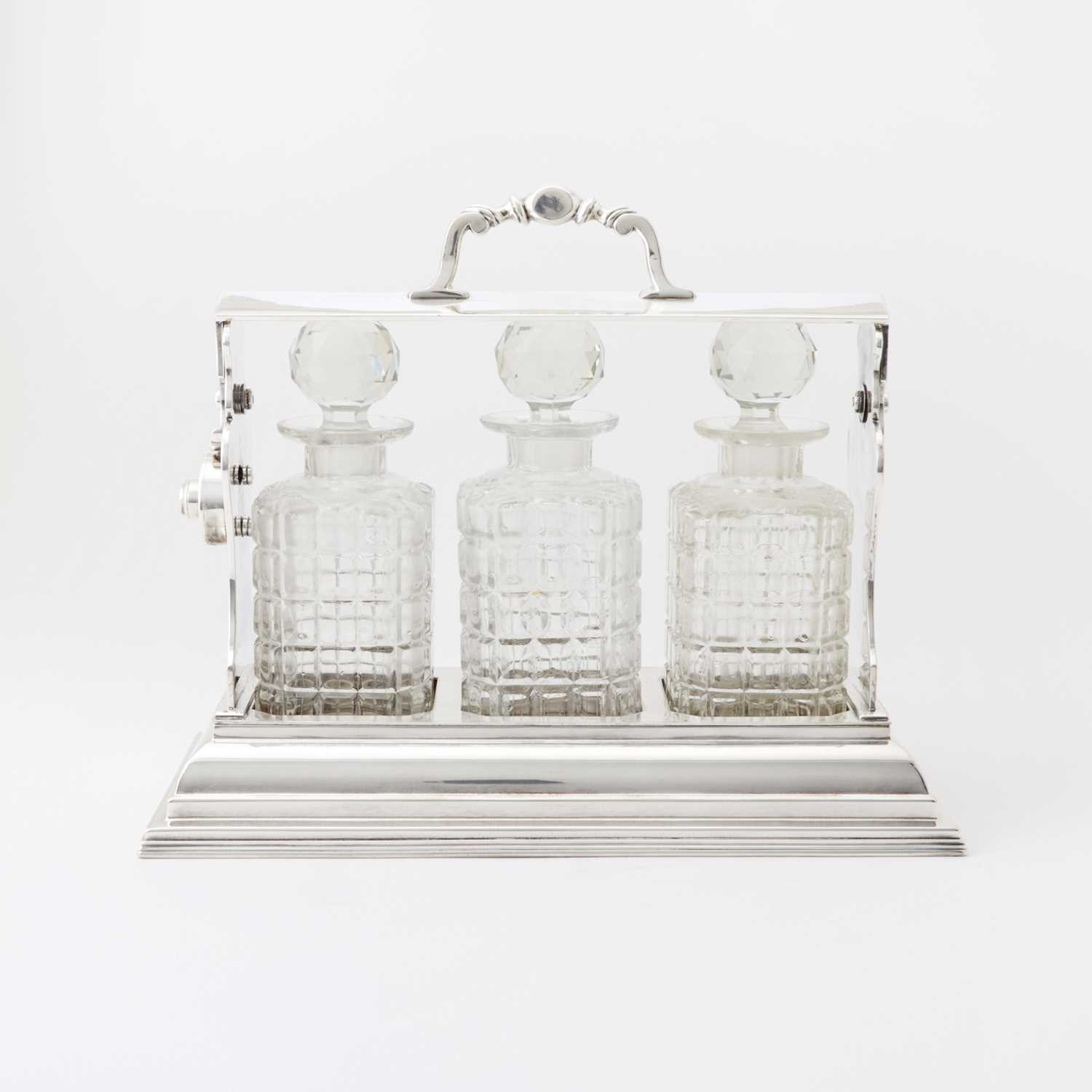 Lot 103 - Silver-Plated Tantalus with Three Glass Decanters