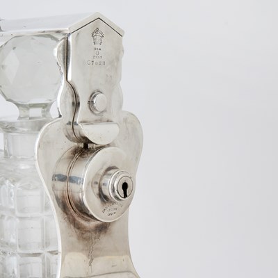Lot 103 - Silver-Plated Tantalus with Three Glass Decanters