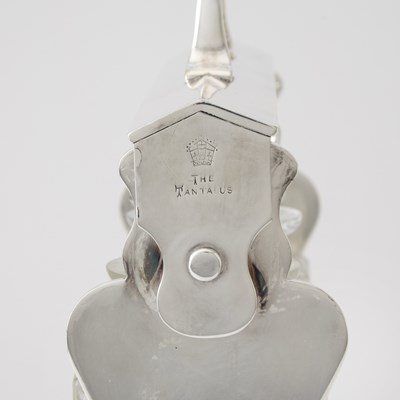 Lot 103 - Silver-Plated Tantalus with Three Glass Decanters