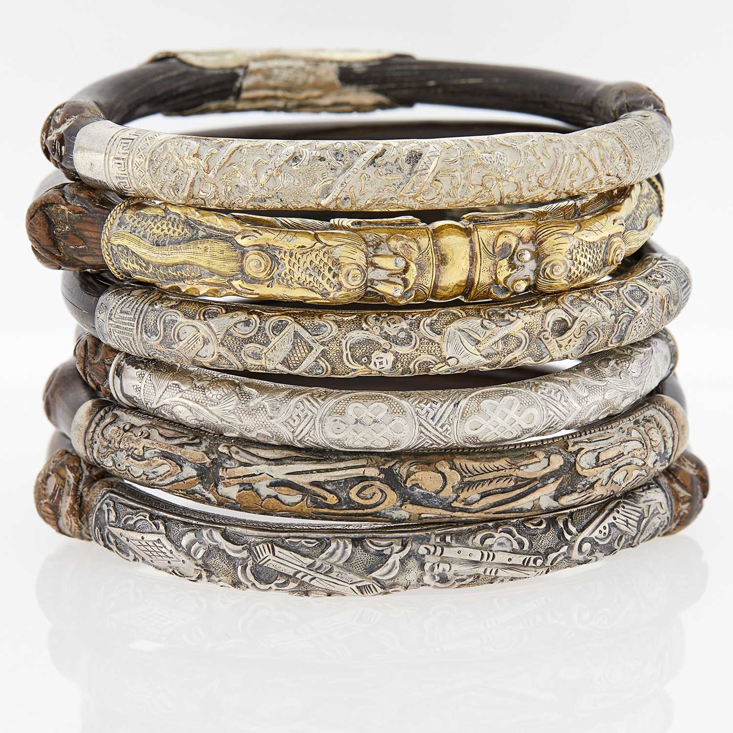 Lot 13 - Group of Wood and Metal Bangle Bracelets