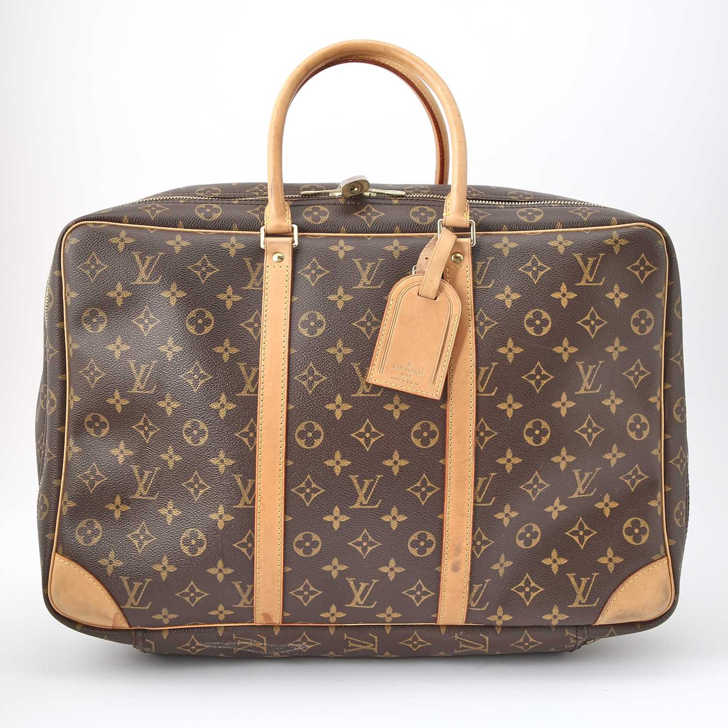 Lot 56 - Louis Vuitton Monogrammed Canvas and Leather Suitcase