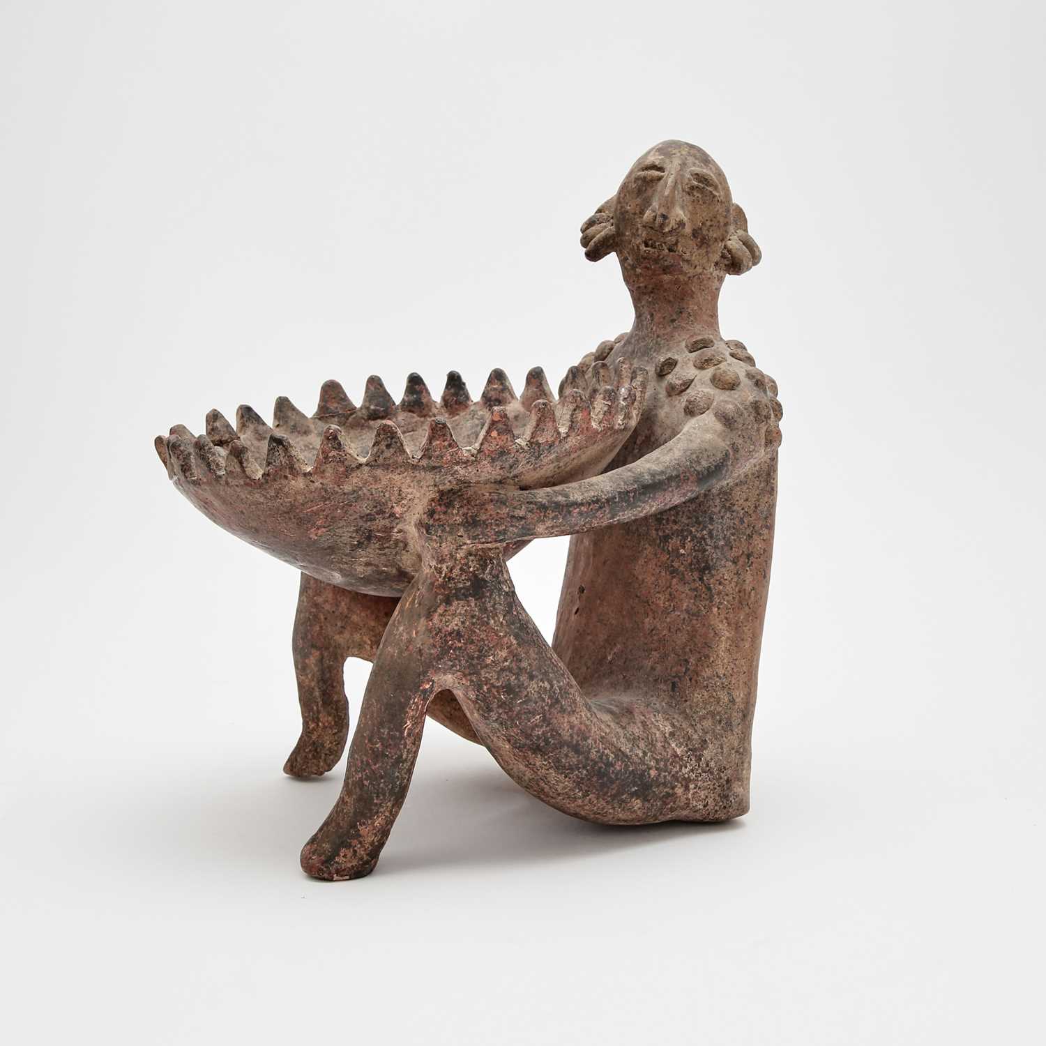 Lot 196 - Jalisco Pottery Seated Figure holding a Bowl