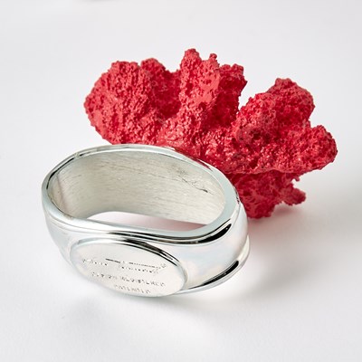 Lot 597 - Set of Eight Hans Turnwald Faux Coral and Silver Plated Napkin Rings