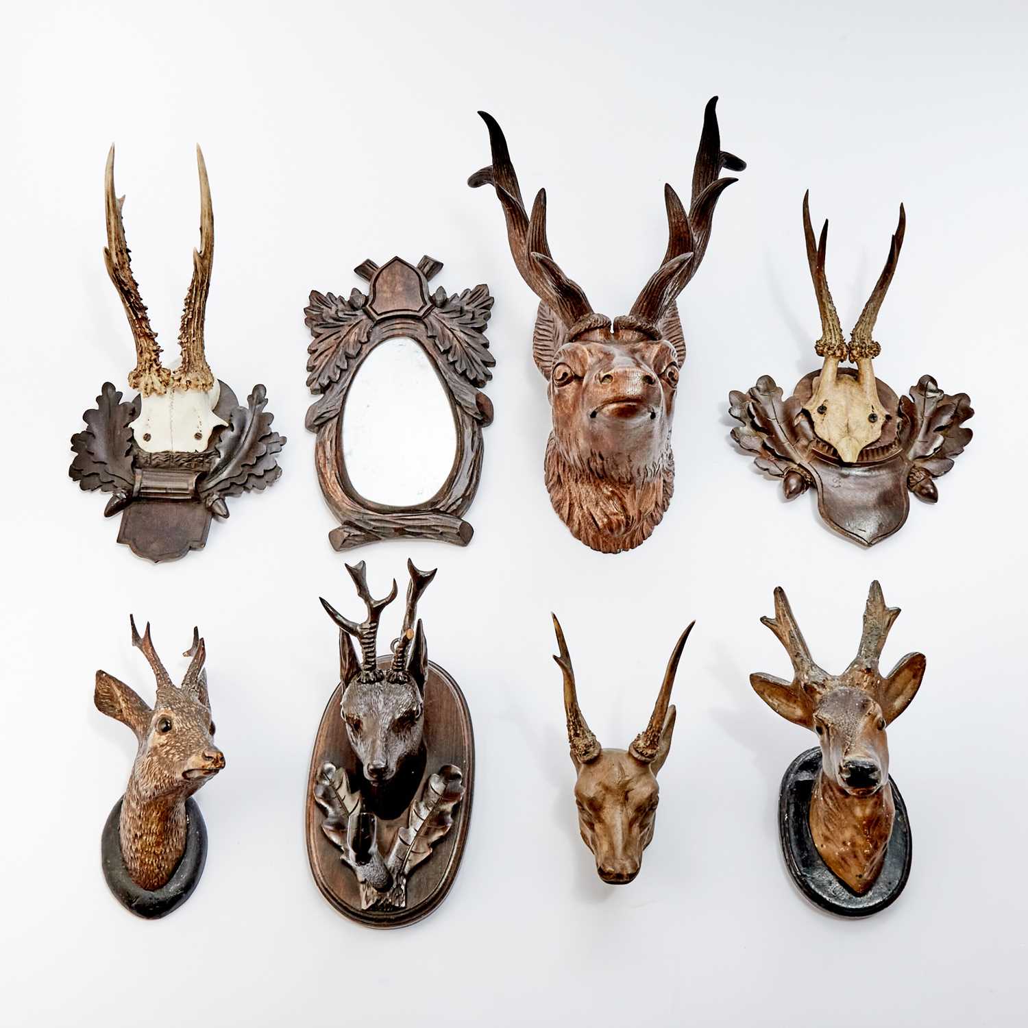 Lot 545 - Group of Black Forest Style Carved Wood Deer and Antler Form Wall Decorations