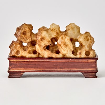 Lot 416 - A Chinese Russet and Celadon Jade Brush Rest