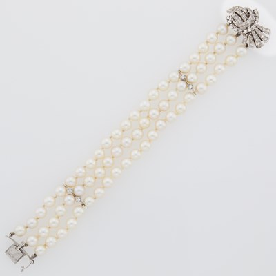 Lot 2149 - Triple Strand Cultured Pearl, White Gold and Diamond Bracelet