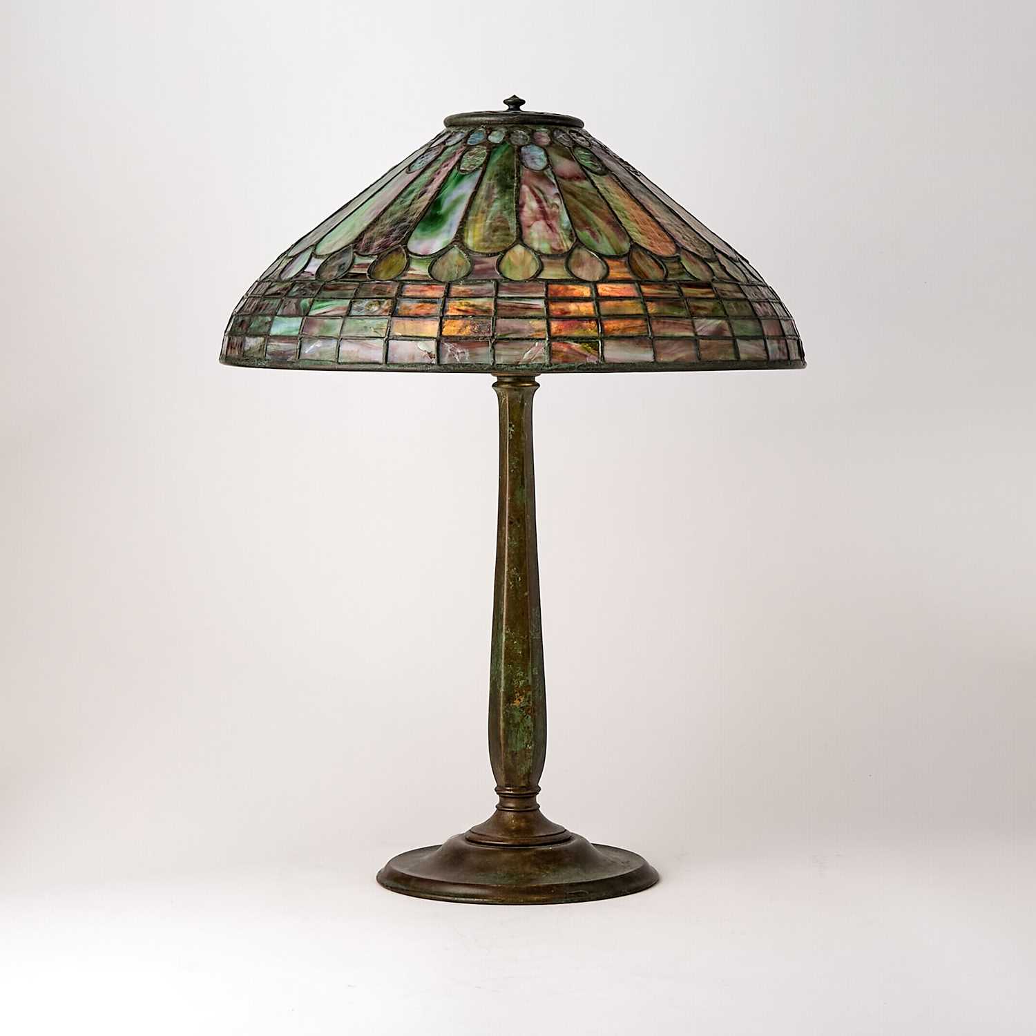 Lot 679 - Tiffany Studios Bronze and Leaded Glass 'Feather’ Table Lamp