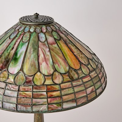 Lot 679 - Tiffany Studios Bronze and Leaded Glass 'Feather’ Table Lamp