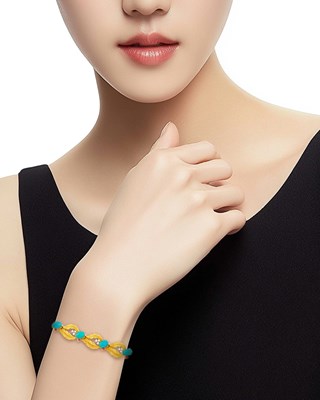 Lot 1017 - Gold, Turquoise, Diamond and Ruby Bracelet