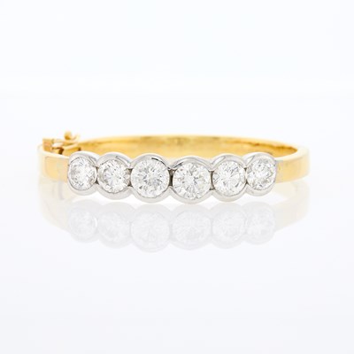 Lot 2135 - Two-Color Gold and Diamond Bangle Bracelet