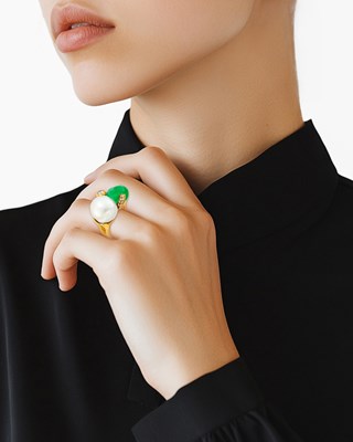 Lot 1085 - Misani Marini Gold, Semi-Baroque South Sea Cultured Pearl, Tumbled Emerald Bead and Diamond Ring