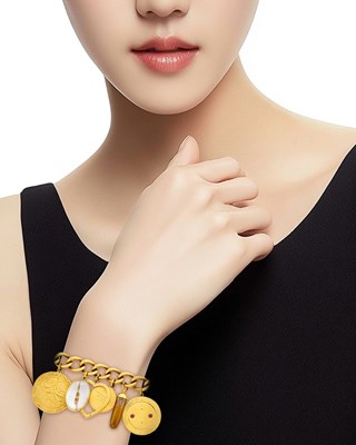 Lot 1015 - Gold, Metal and Gem-Set Charm Bracelet