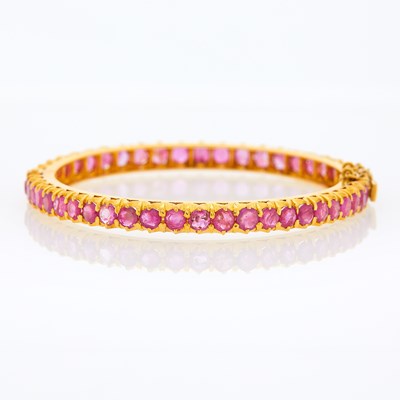 Lot 2185 - Gold and Ruby Bangle Bracelet