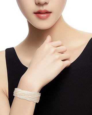 Lot 1033 - Multistrand Cultured Pearl Torsade Bracelet with White Gold, Aquamarine and Diamond Clasp