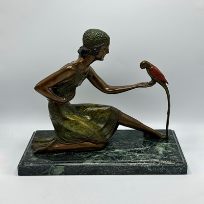 Lot 1073 - Figure of a Woman Feeding a Parrot, After Demetre H. Chiparus