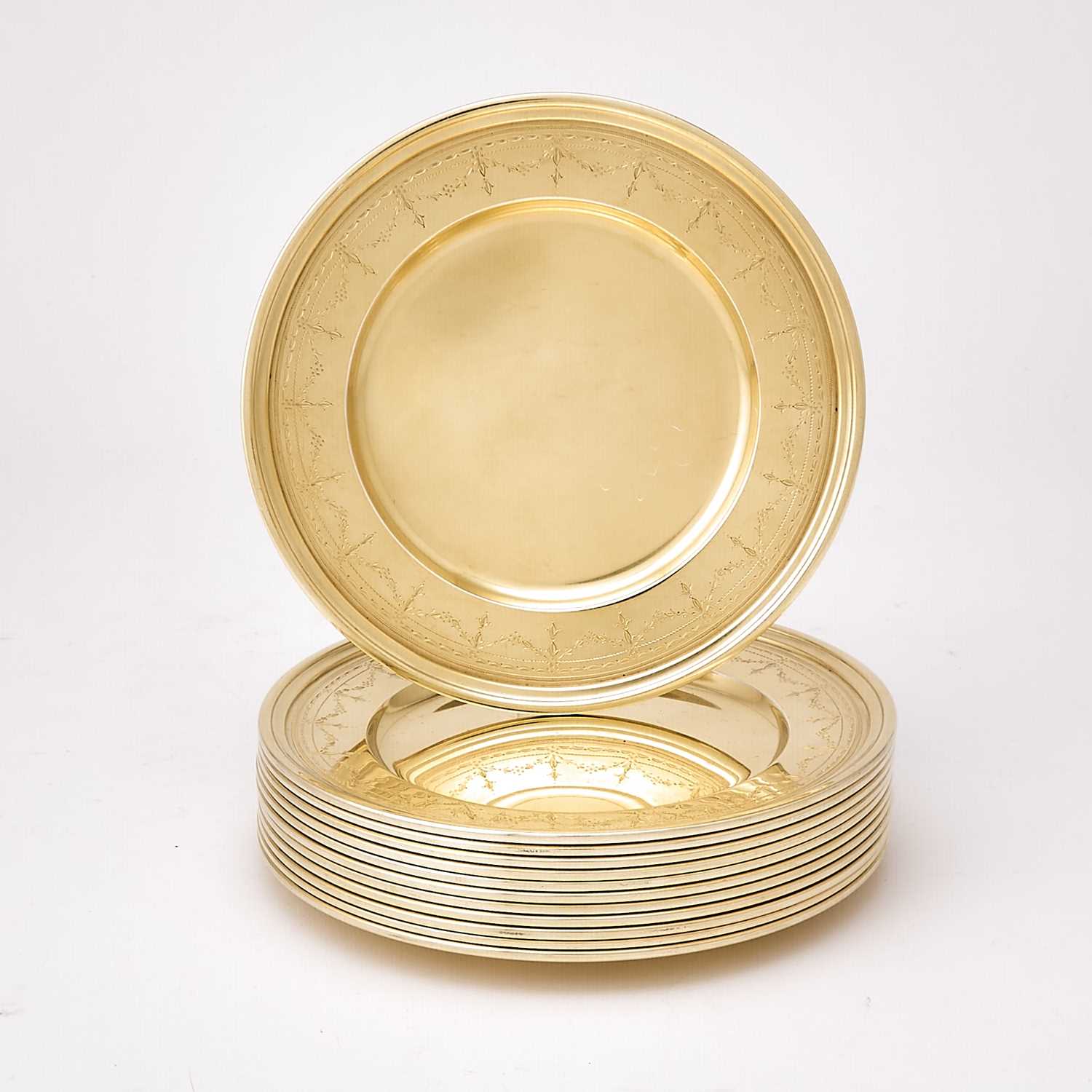 Lot 41 - Set of Twelve Tiffany & Co. Sterling Silver-Gilt Bread Plates