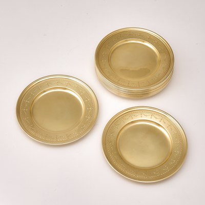 Lot 41 - Set of Twelve Tiffany & Co. Sterling Silver-Gilt Bread Plates