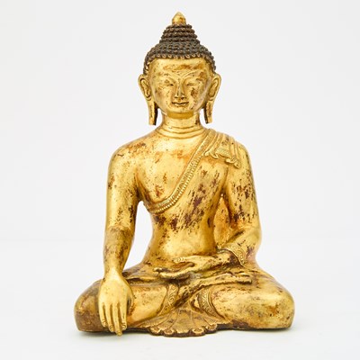 Lot 9 - A Sino-Tibetan Gilt Bronze Figure of Seated Shakyamuni