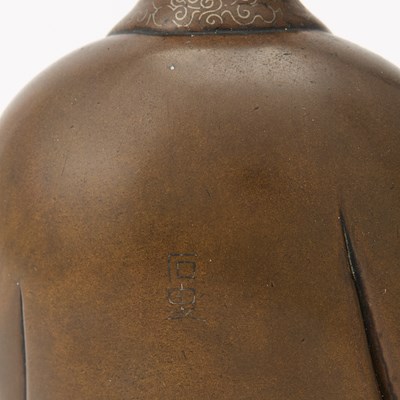 Lot 54 - A Finely-Cast Chinese Wire-Inlaid Bronze Figure of Guanyin