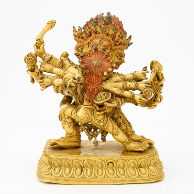 Lot 47 - A Tibetan Gilt Bronze Figure of Mahakala with Consort