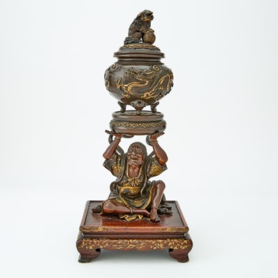 Lot 33 - A Japanese Parcel Gilt Bronze Koro on Figural Base