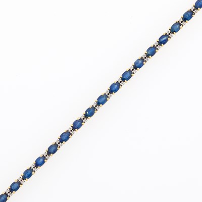 Lot 2254 - Two-Color Gold, Sapphire and Diamond Bracelet