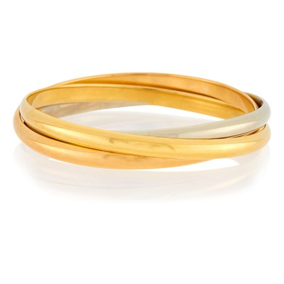 Lot 1 - Cartier Tricolor Gold 'Trinity' Rolling Bangle Bracelet, France