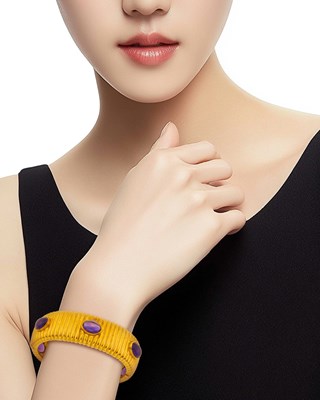Lot 1014 - Tambetti Ribbed Gold and Cabochon Amethyst Bangle Bracelet, Pair of Earclips and Ring
