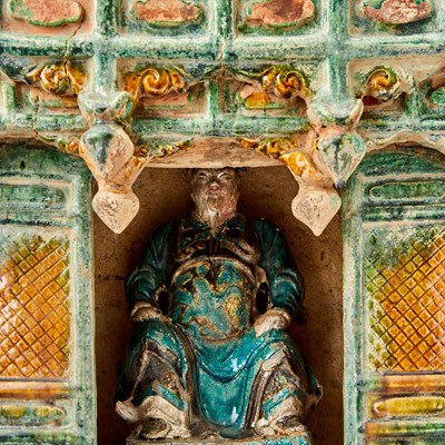 Lot 129 - Chinese Glazed Pottery Figure of Guandi and Shrine