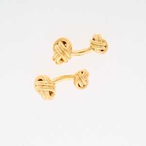 Lot 2045 - Tiffany & Co. Pair of Gold Love Knot Cufflinks