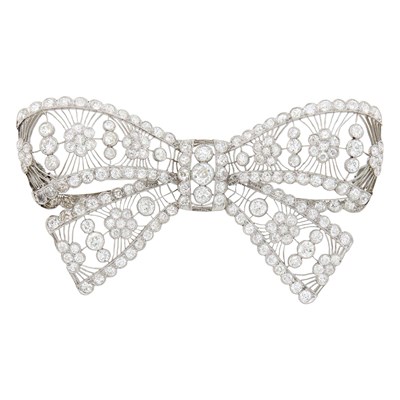 Lot 202 - Belle Epoque Platinum and Diamond Filigree Bow Brooch