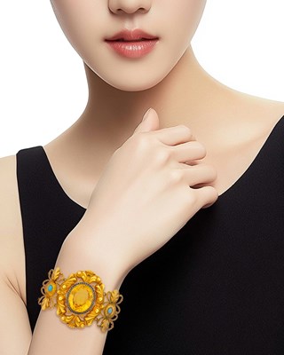 Lot 1075 - Antique Repoussé Gold, Citrine, Black Enamel and Turquoise Bracelet
