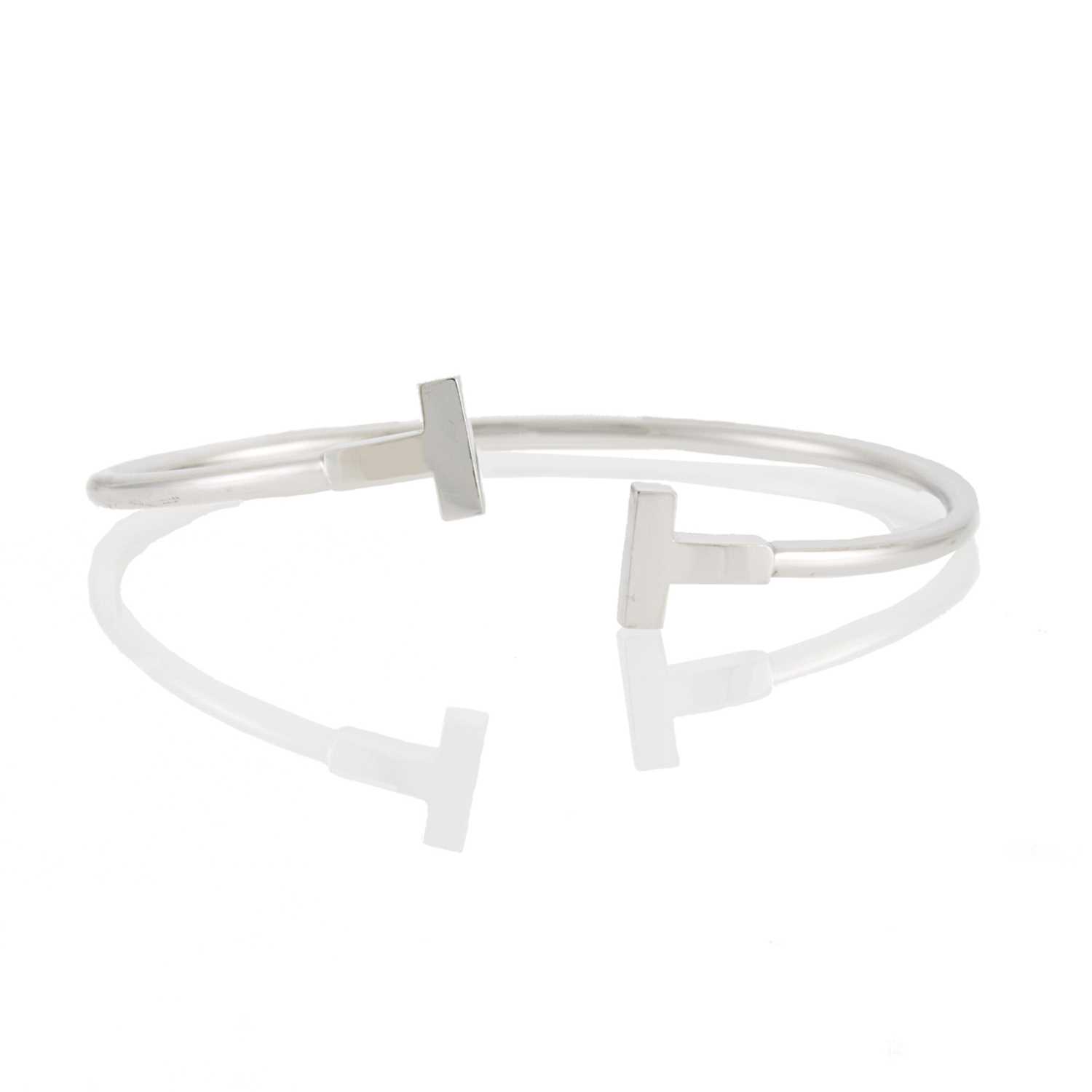 Lot 2099 - Tiffany and Co. White Gold 'T' Bangle Bracelet
