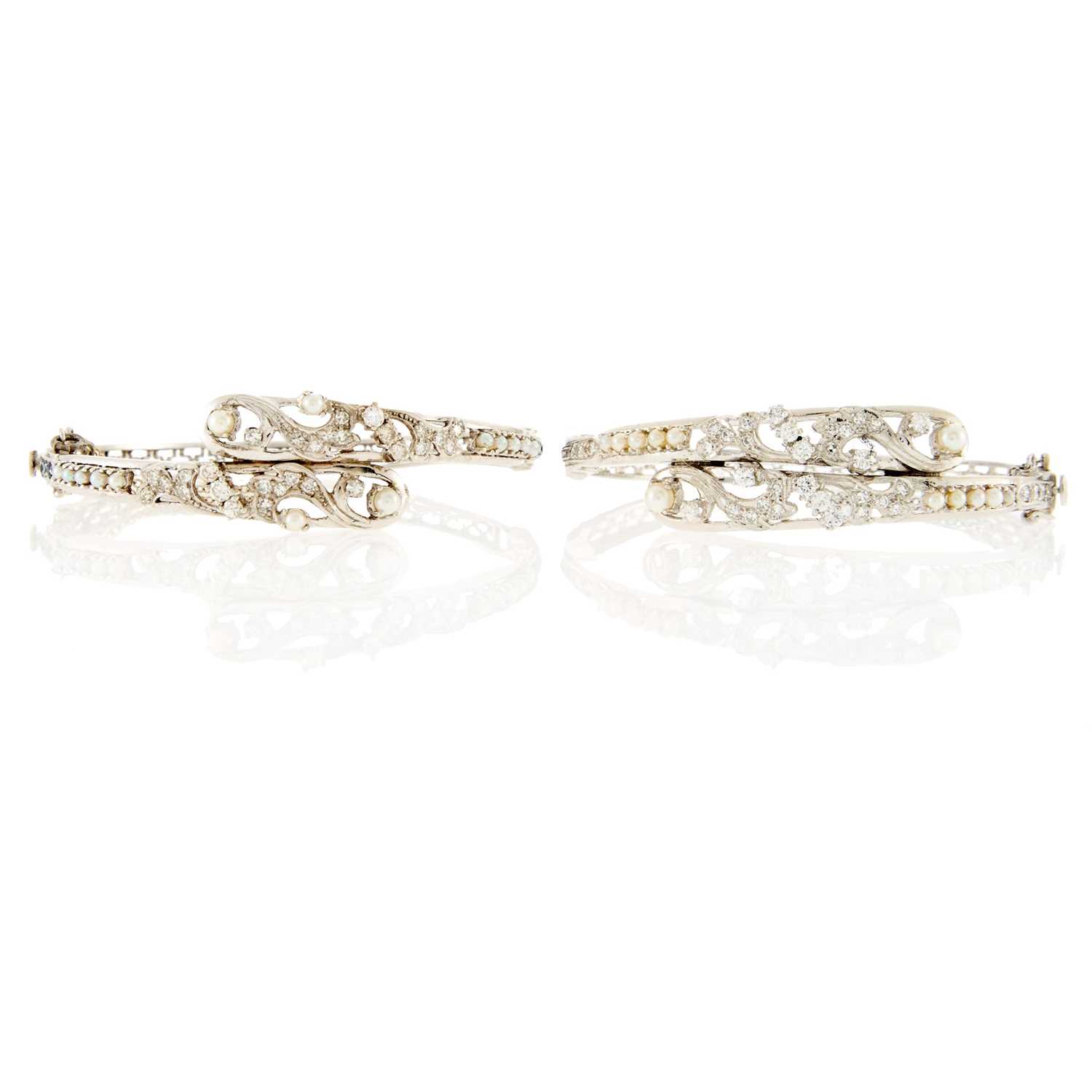 Lot 2107 - Pair of White Gold, Diamond, Cultured Pearl and Sapphire Bangle Bracelets